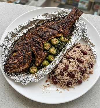 Roast jerk fish in foil with okra and rice and peas